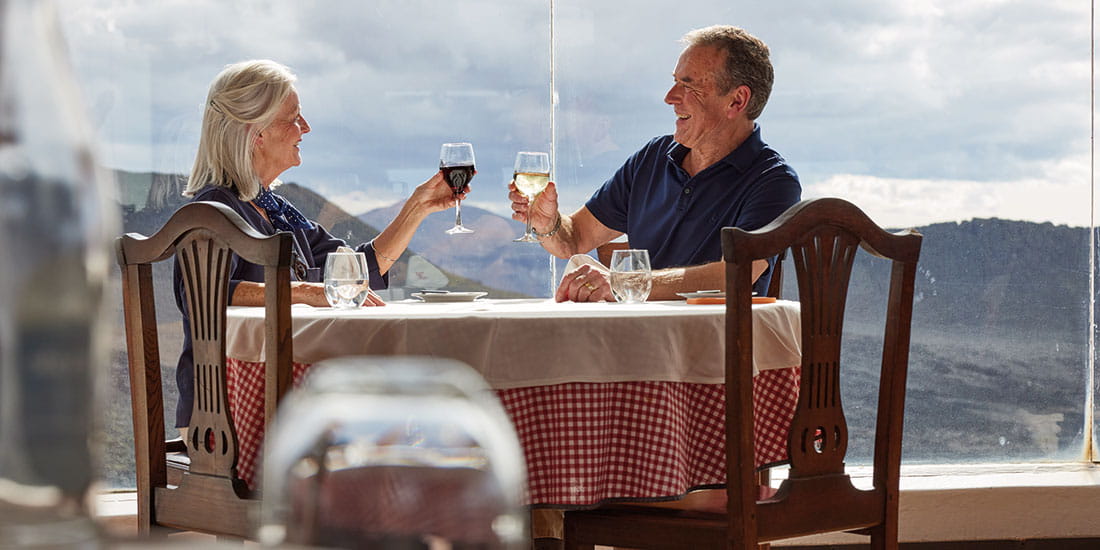 A couple enjoying wine in the El Diablo Restaurant on Fire Mountain in Timanfaya National Park, Lanzarote